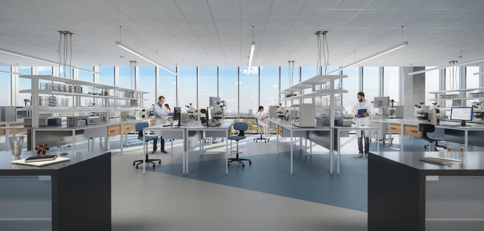 Scientists working in open concept lab space with city views